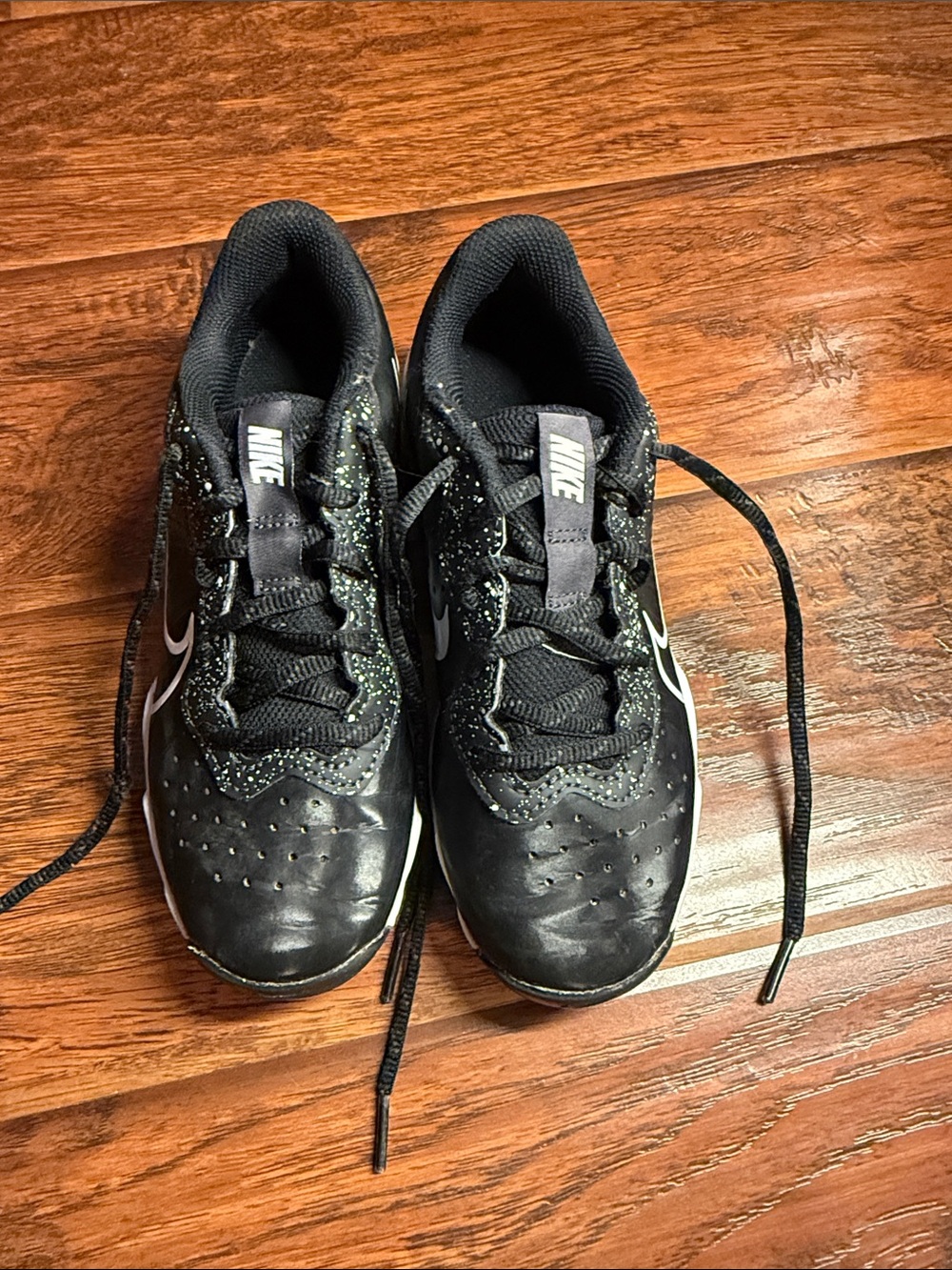 3youth gently used  cleats Nike Black Sneakers with White Swoosh